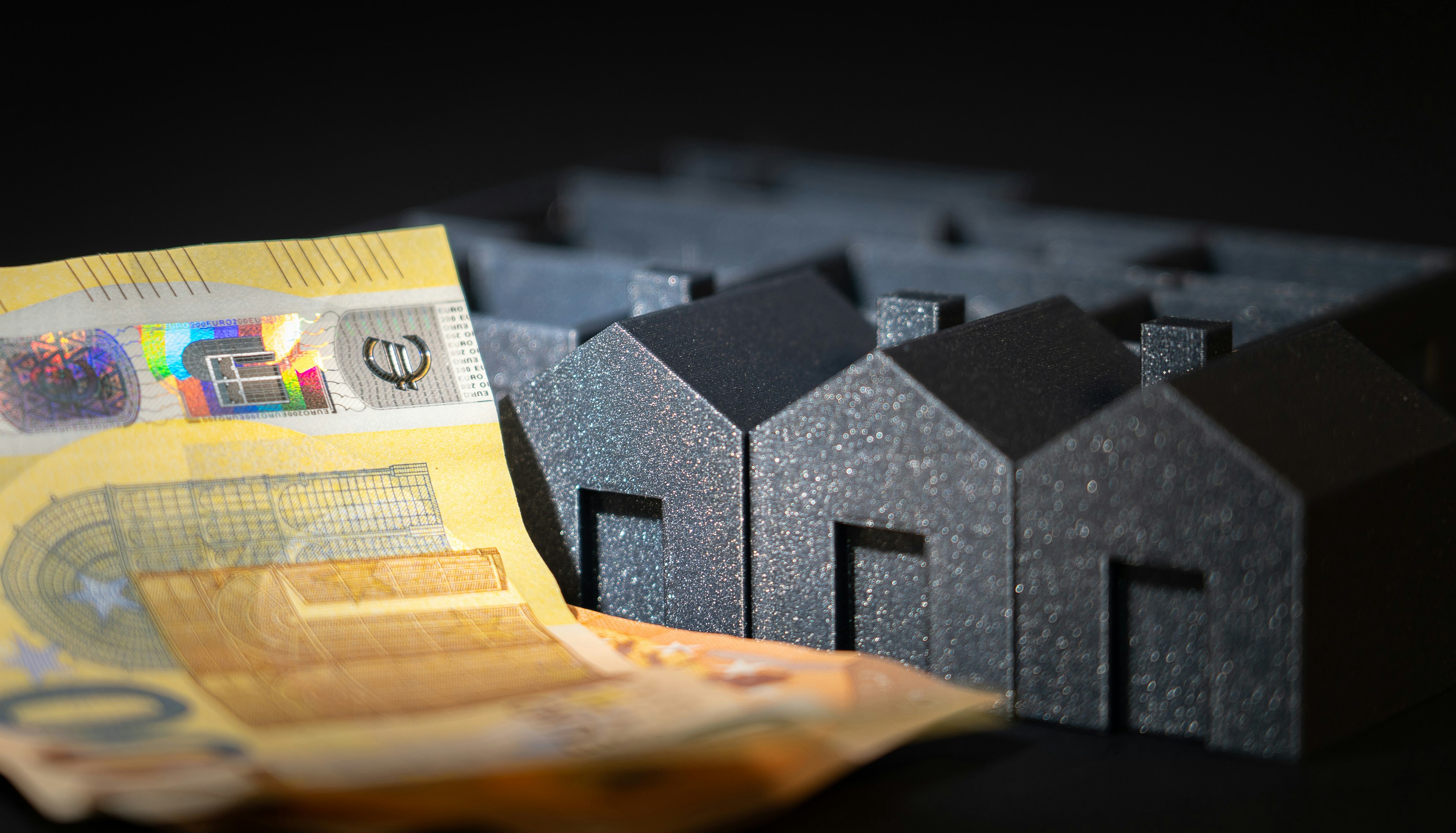 Housing estate model. Business finance cash banknotes.